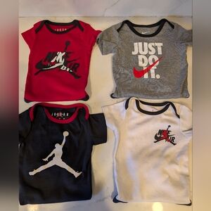 Bundle four 9 month old Nike air jordan Onesies
